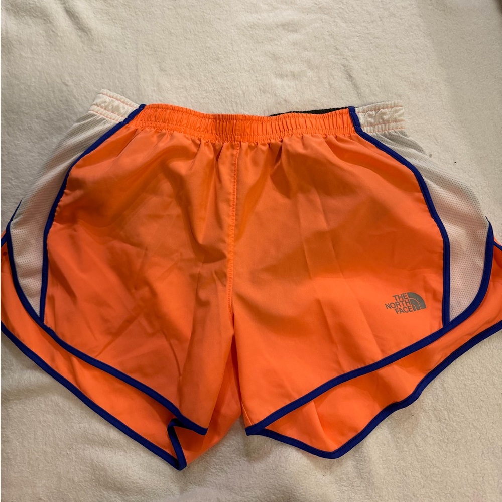The North Face Vibrant Orange Shorts with Blue Accents